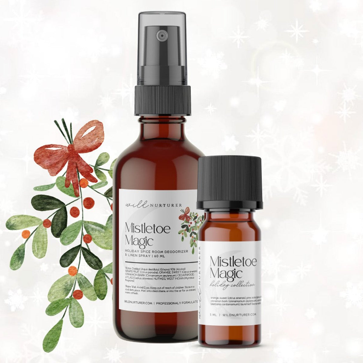 Two bottles of Wild Nurturer Aromatherapy's "Mistletoe & Magic Yuletide Aromatic Blend" with mistletoe and holly decoration on a snowy background.