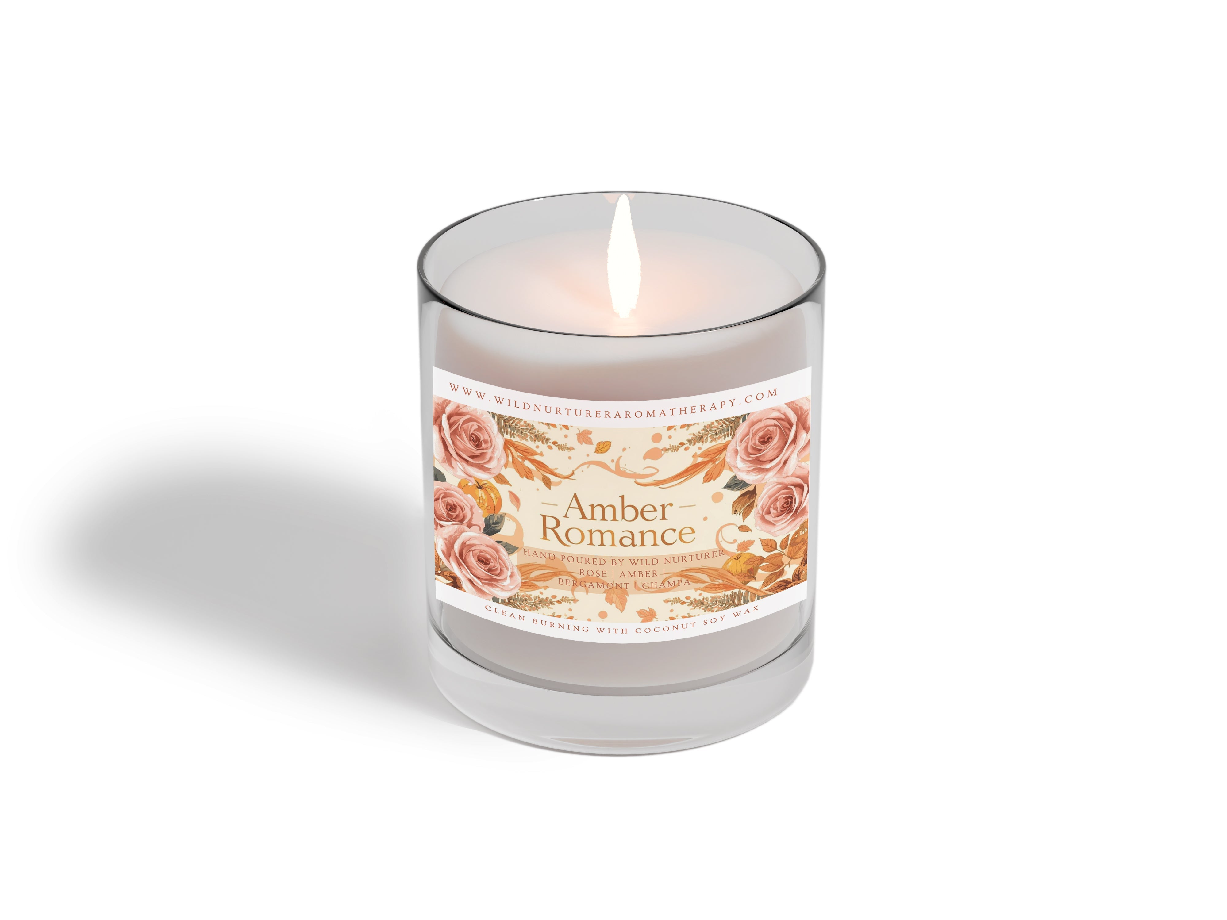 A green candle, two dropper bottles, and dried lavender branches are placed on a light fabric surface.