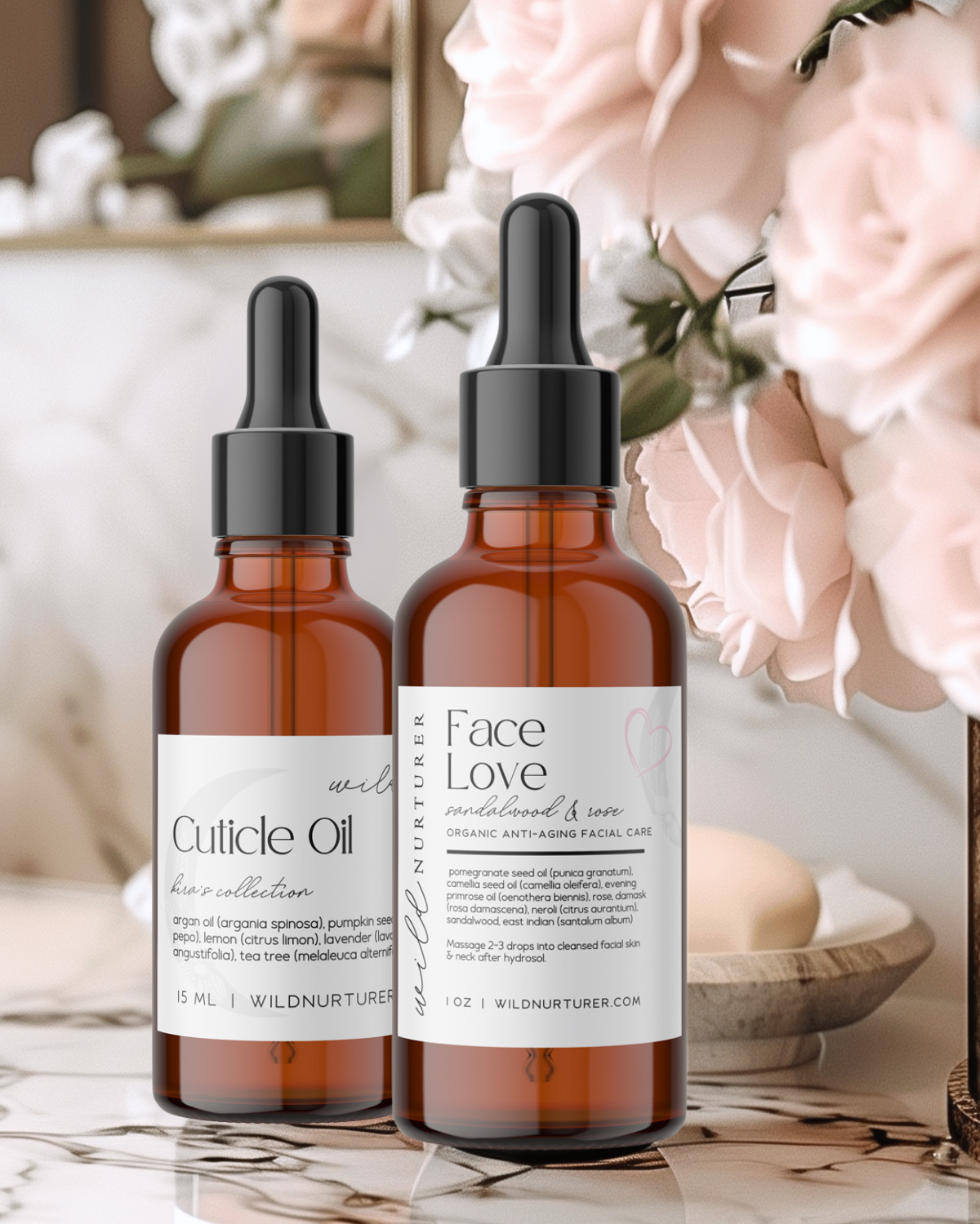 Two bottles of skincare oils labeled "Cuticle Oil" and "Face Love Oil" on a bathroom counter with decorative flowers in the background.