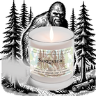 A lit Candle - Tropical Rain by Heaven & Earth Aromatherapy sits before a black and white Sasquatch pine forest illustration. The label highlights refreshing tropical aromatics for an immersive, nature-inspired vibe.