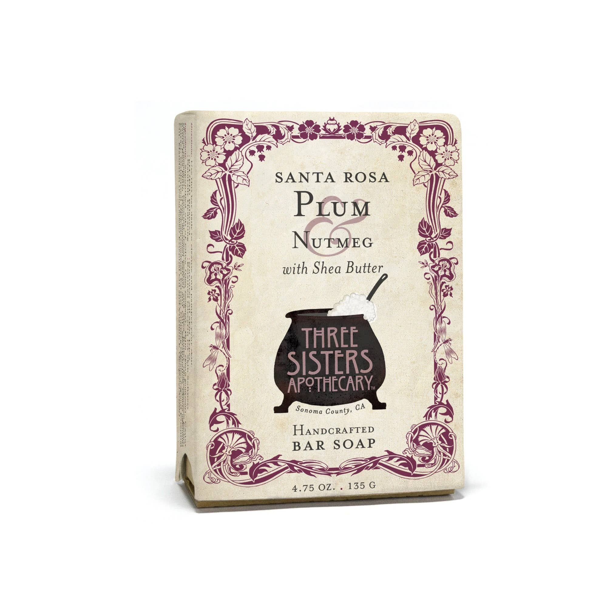 The packaging for the Soap Cauldron bar soap showcases the rich, antioxidant-infused blend of "Santa Rosa Plum & Nutmeg," complemented by nourishing Shea Butter. The soap weighs 4.75 oz / 135 g.