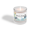 Heaven & Earth Aromatherapy’s Siren's Song candle fills your space with Irish moss, marine notes, and lavender, capturing a coastal vibe in a clear glass jar with ocean-inspired artwork.