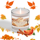 A lit Chai Latte Soy Candle from Wild Nurturer Aromatherapy sits surrounded by autumn leaves, a cinnamon stick, and an orange slice. The label highlights notes of vanilla, chai spice, and honey with a soy wax base—making this fall-scented candle the perfect way to bring cozy warmth into your home.