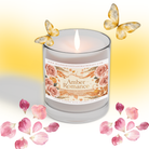 A lit Pumpkin Spice Soy Candle labeled “Classic Pie Spice + Ginger” from Wild Nurturer Aromatherapy is surrounded by autumn leaves and warm spices against a cozy orange background.