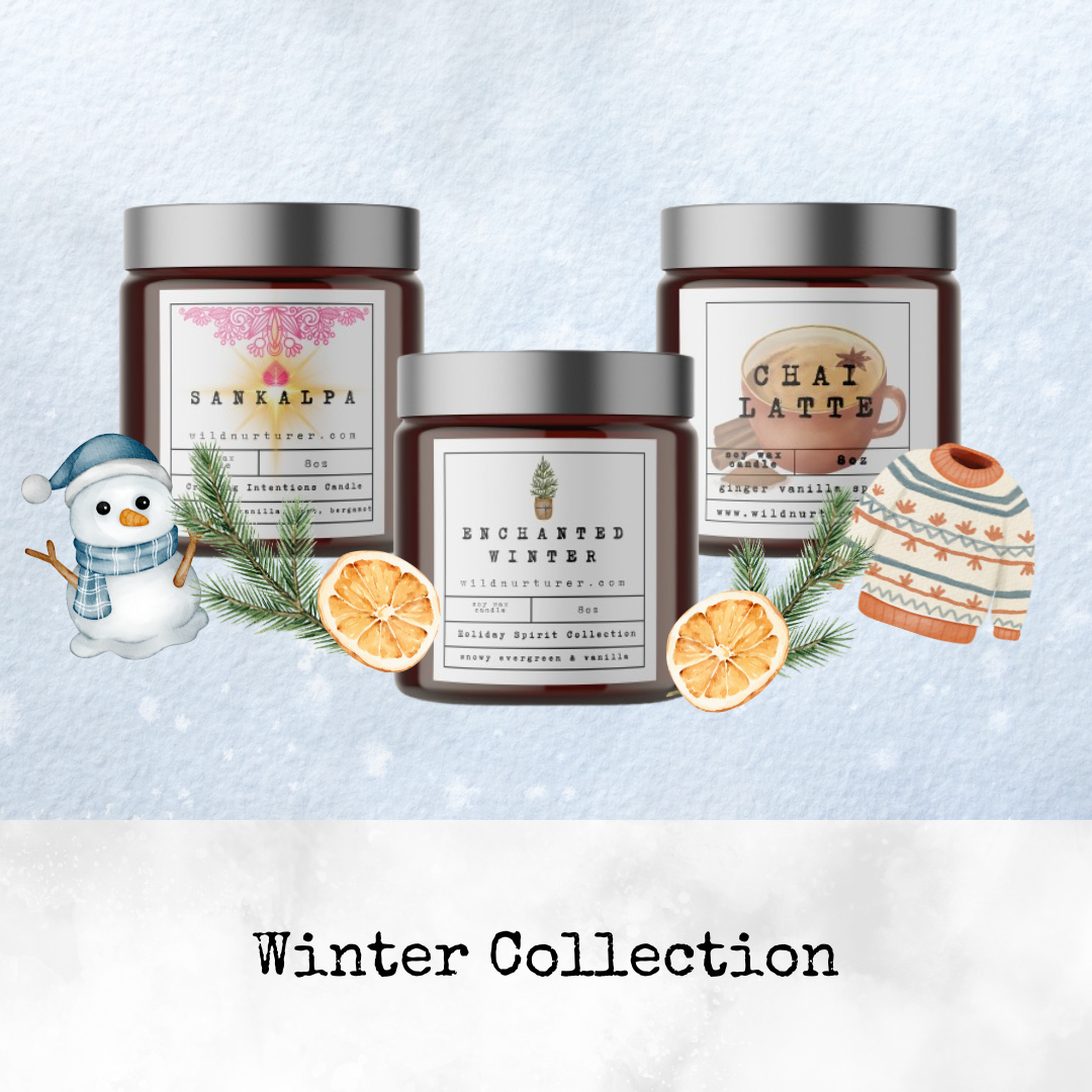 Three scented candle jars from Heaven & Earth Aromatherapy's Holiday Candle Collection—Sankalpa, Enchanted Winter, and Chai Latte—surrounded by winter-themed decorations and text reading "Winter Collection.