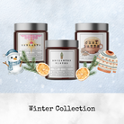 Three scented candle jars from Heaven & Earth Aromatherapy's Holiday Candle Collection—Sankalpa, Enchanted Winter, and Chai Latte—surrounded by winter-themed decorations and text reading "Winter Collection.