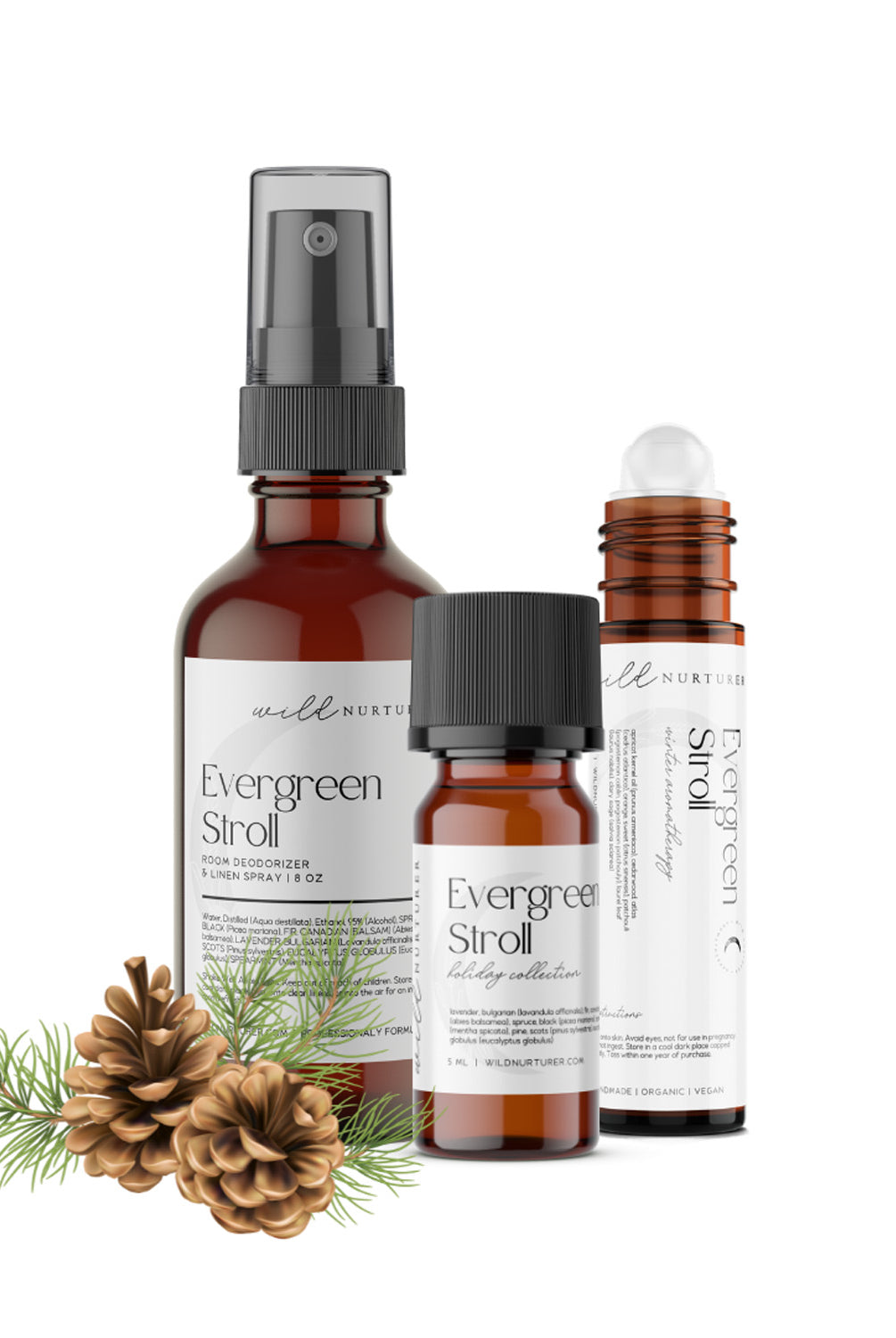 Three Evergreen Stroll - Winter Perfumery Diffuser Blend products from Wild Nurturer Aromatherapy, including a spray bottle and two small bottles, accompanied by pine cones and pine needles on a white background.